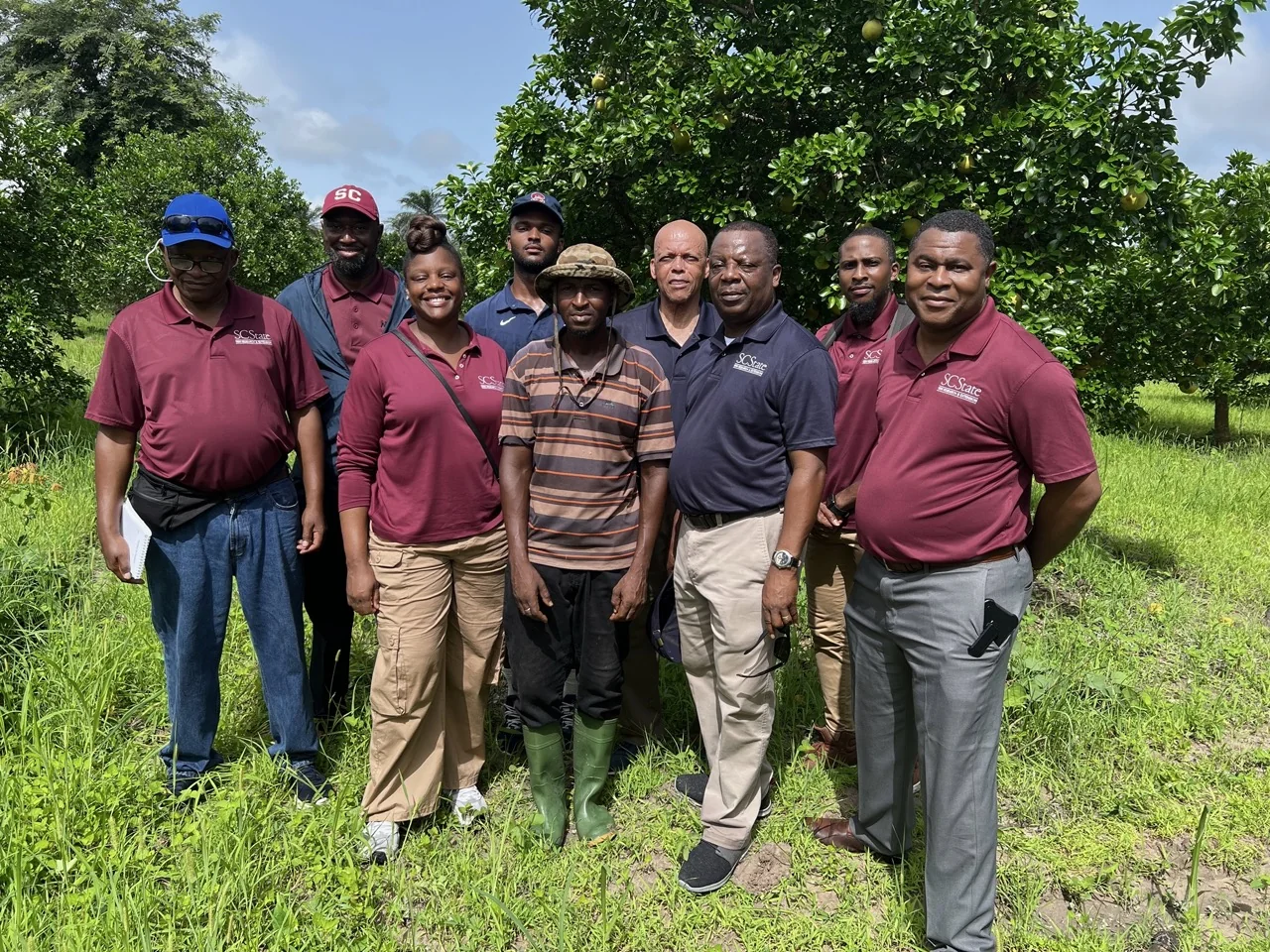 Dr. Louis D. Whitesides with students and community participants during an international engagement activity