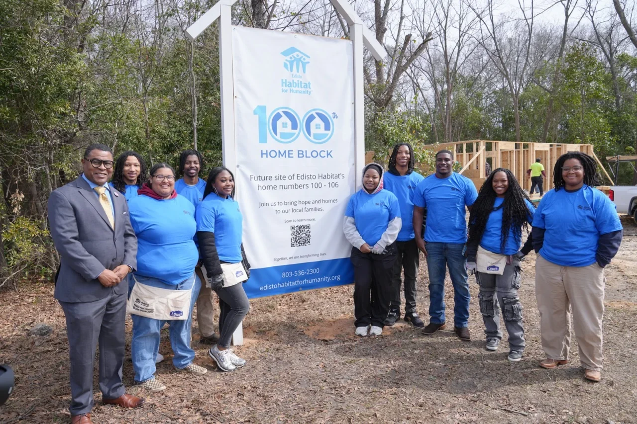 Dr. Louis D. Whitesides with students and community participants at a Habitat for Humanity service site
